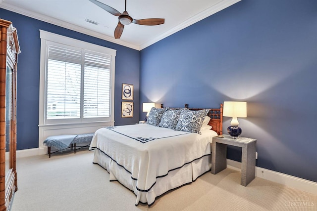 bedroom featuring carpet floors, crown molding, baseboards, and ceiling fan