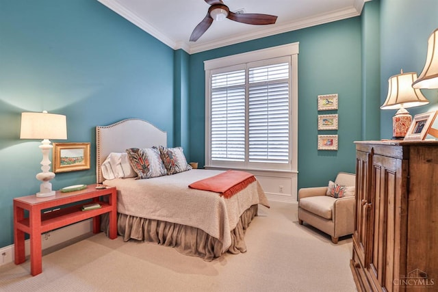 bedroom featuring carpet flooring, ornamental molding, and ceiling fan