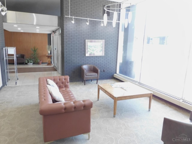 living room featuring brick wall