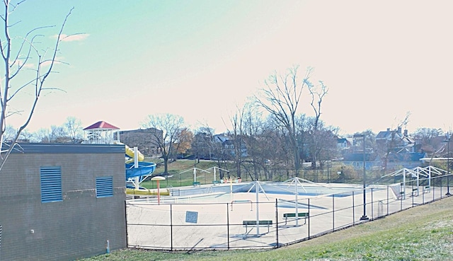 view of pool featuring a swimming pool, fence, and a patio area