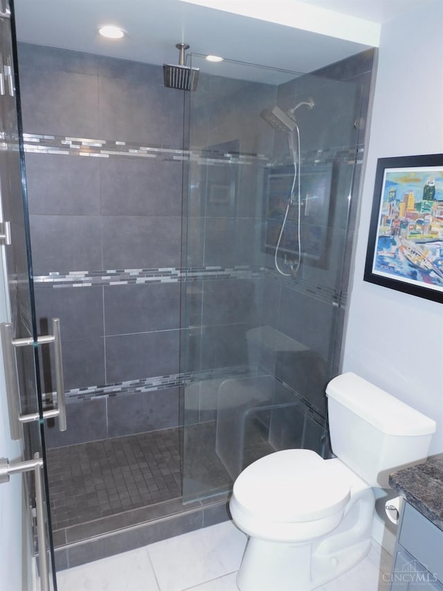 full bath featuring a shower stall, vanity, toilet, and recessed lighting