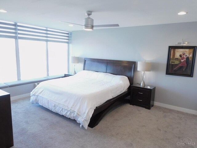 bedroom featuring baseboards, light colored carpet, recessed lighting, and ceiling fan
