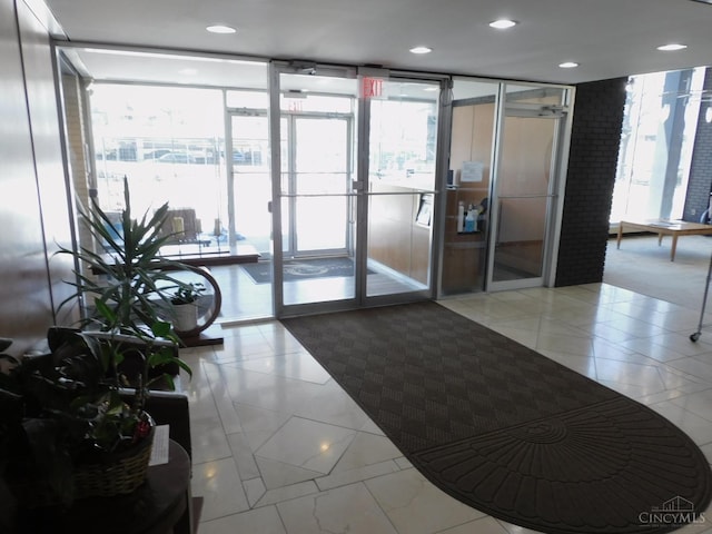 lobby featuring a wall of windows and recessed lighting