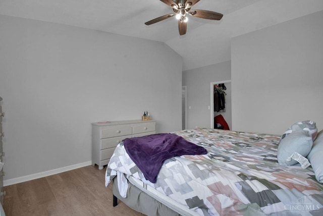 1740 Piper Ln Unit 206, Centerville, OH 45440 - bedroom with wood finished floors, vaulted ceiling, ceiling fan, and baseboards