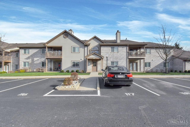1740 Piper Ln Unit 206, Centerville, OH 45440 - view of building exterior featuring uncovered parking