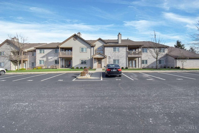 1740 Piper Ln Unit 206, Centerville, OH 45440 - view of property with uncovered parking and a residential view