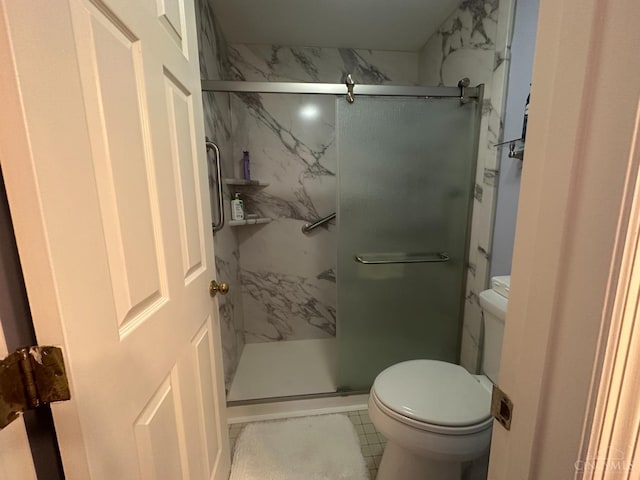 full bathroom with a marble finish shower and toilet