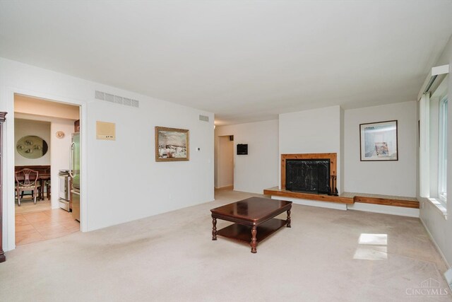 5672 Crooked Tree Ln, Miami Twp, OH 45150 - living area with light colored carpet and a fireplace with raised hearth