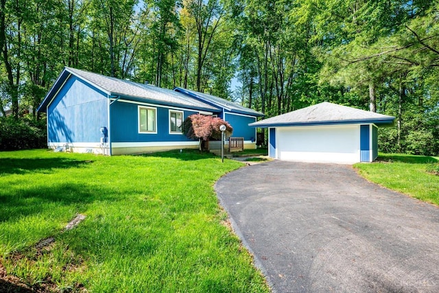 5672 Crooked Tree Ln, Miami Twp, OH 45150 - ranch-style home with an outbuilding, a garage, and a front yard