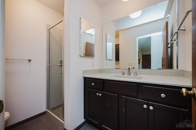 5672 Crooked Tree Ln, Miami Twp, OH 45150 - full bathroom with toilet, tile patterned flooring, a shower stall, vanity, and baseboards
