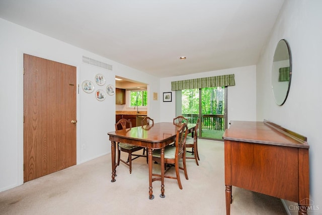 5672 Crooked Tree Ln, Miami Twp, OH 45150 - dining room featuring light colored carpet