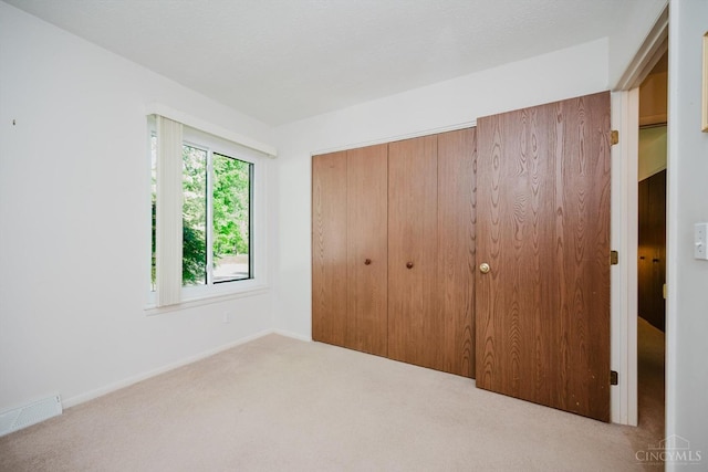 5672 Crooked Tree Ln, Miami Twp, OH 45150 - unfurnished bedroom featuring carpet, a closet, and baseboards