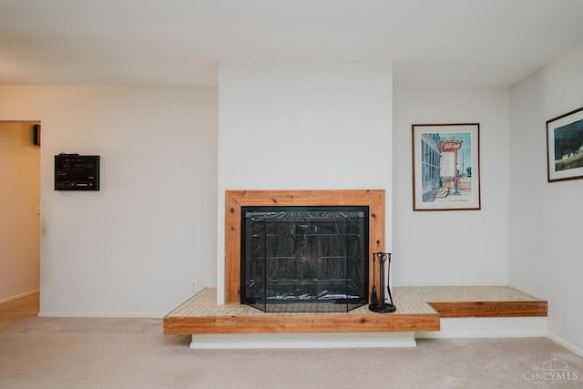 5672 Crooked Tree Ln, Miami Twp, OH 45150 - detailed view of a fireplace with raised hearth, carpet, and baseboards