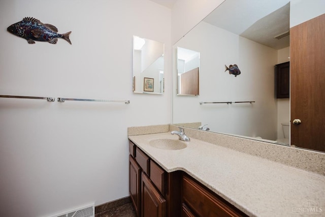 5672 Crooked Tree Ln, Miami Twp, OH 45150 - bathroom with vanity, toilet, and baseboards