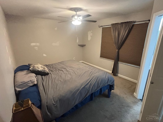 bedroom with carpet, baseboards, and a ceiling fan