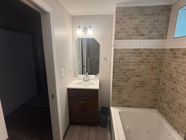 full bathroom with wood finished floors, vanity, and a combined bath / shower with jetted tub