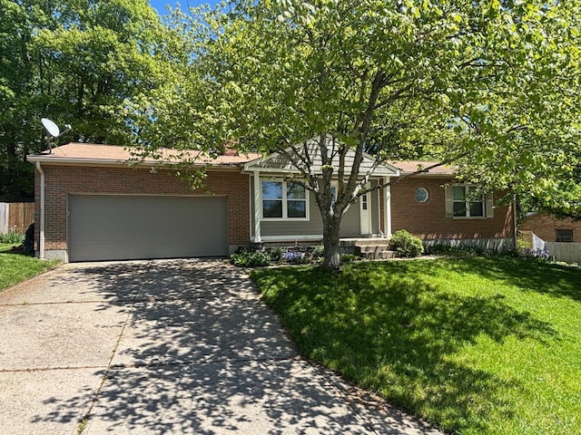 ranch-style home with brick siding, driveway, and a garage