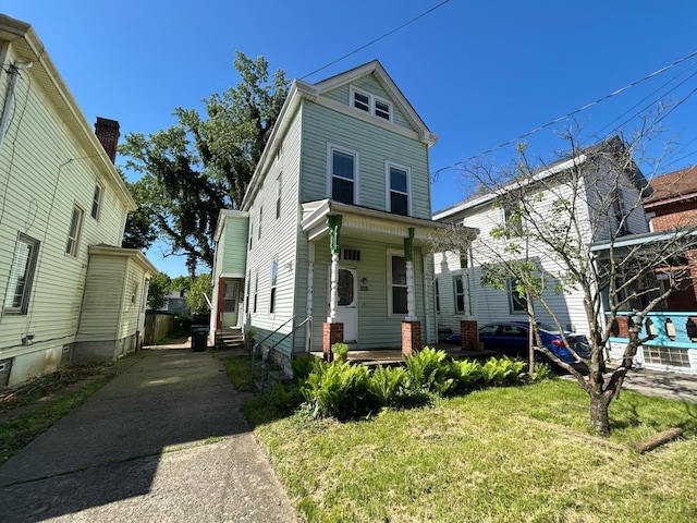 view of front of house featuring covered porch and driveway