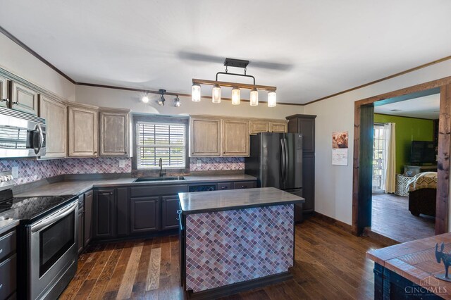 6241 Marathon Edenton Rd, Wayne Twp, OH 45107 - kitchen featuring stainless steel appliances, dark countertops, ornamental molding, decorative backsplash, and dark wood-style flooring