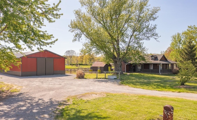 6241 Marathon Edenton Rd, Wayne Twp, OH 45107 - view of yard with an outbuilding, an outdoor structure, a detached garage, and dirt driveway