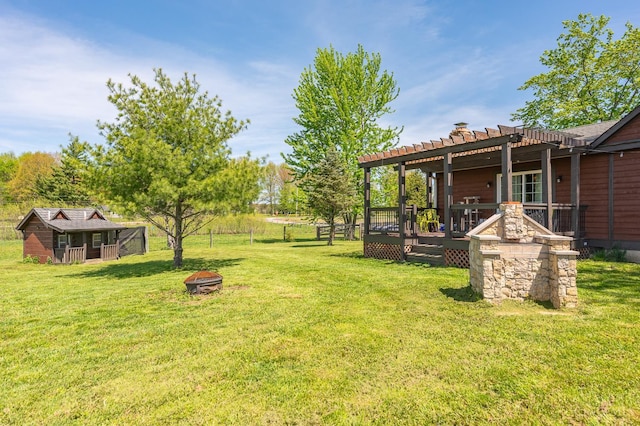 6241 Marathon Edenton Rd, Wayne Twp, OH 45107 - view of grassy yard featuring an outdoor fire pit, a pergola, and a wooden deck