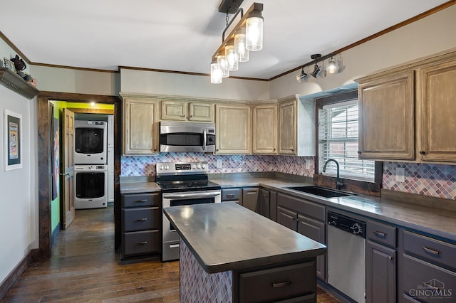 6241 Marathon Edenton Rd, Wayne Twp, OH 45107 - kitchen with stainless steel appliances, estacked washer and dryer, crown molding, tasteful backsplash, and a center island