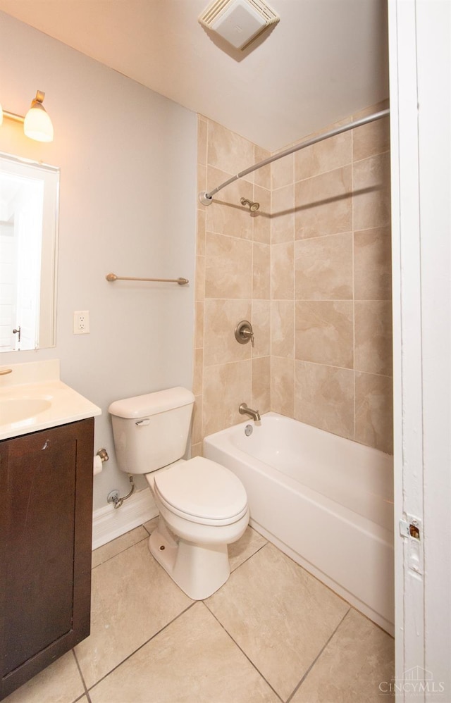 full bath featuring tile patterned floors, toilet, washtub / shower combination, and vanity