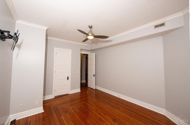 unfurnished bedroom with baseboards, ornamental molding, wood finished floors, and a ceiling fan