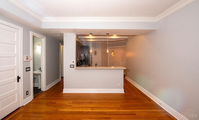 bar with crown molding, baseboards, wood finished floors, and pendant lighting