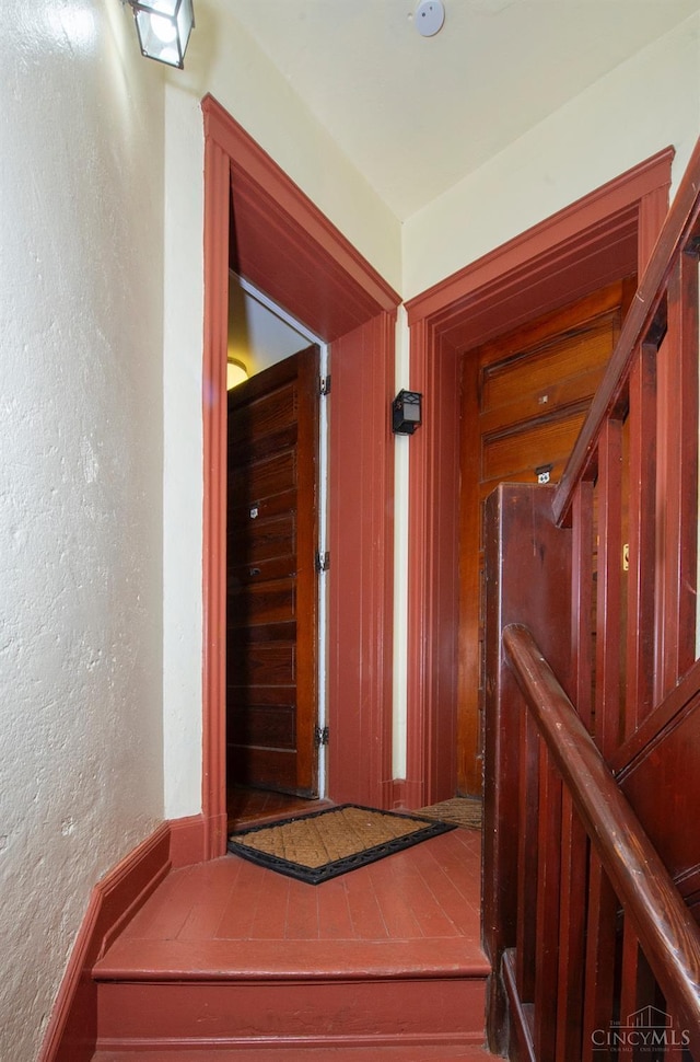 hall with a textured wall