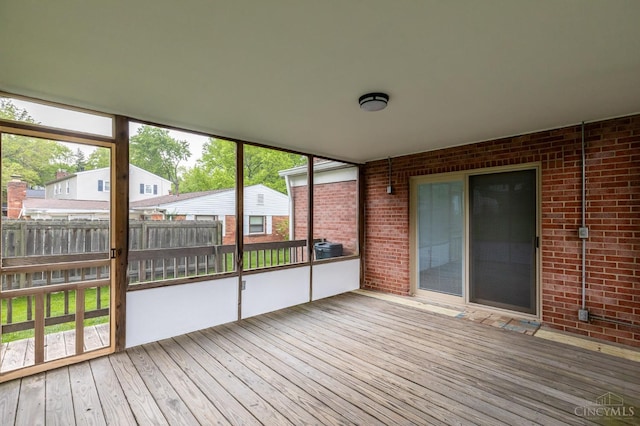 unfurnished sunroom with plenty of natural light
