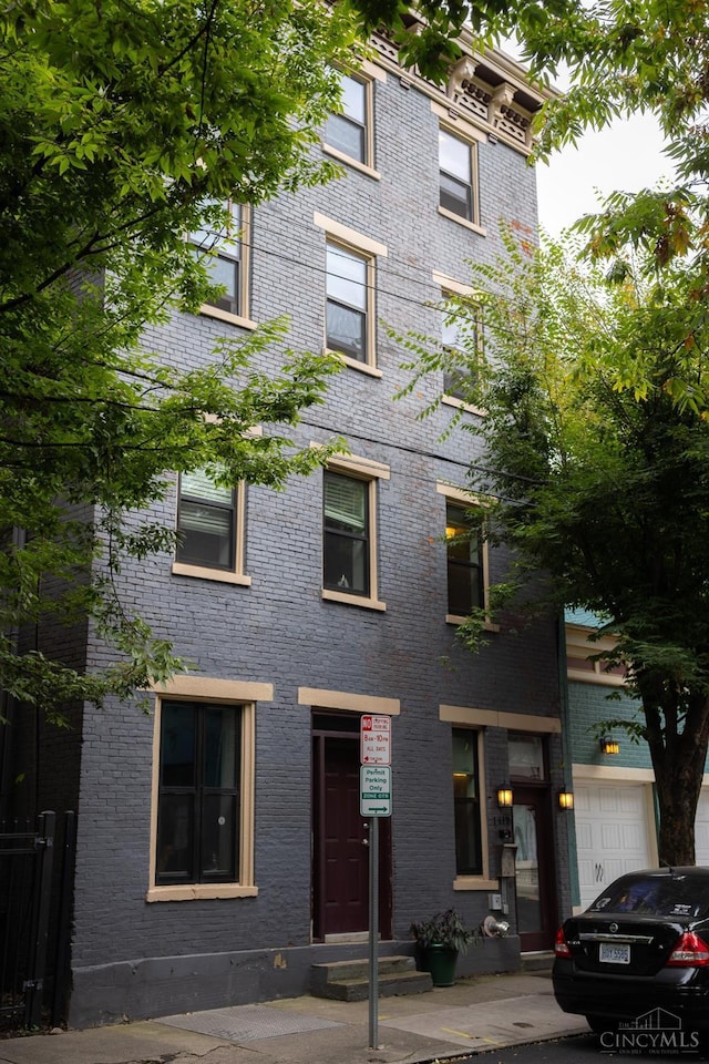 view of front of property featuring brick siding