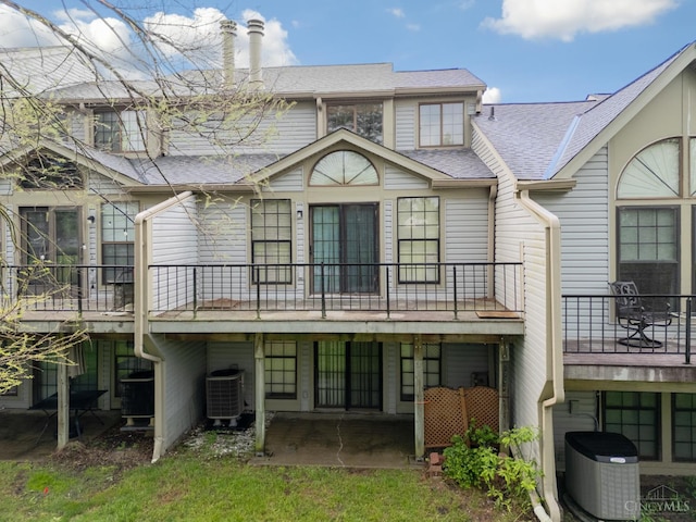 2869 Phaeton Ln, Deerfield Twp, OH 45039 - back of property with central AC, a shingled roof, a patio area, and a balcony