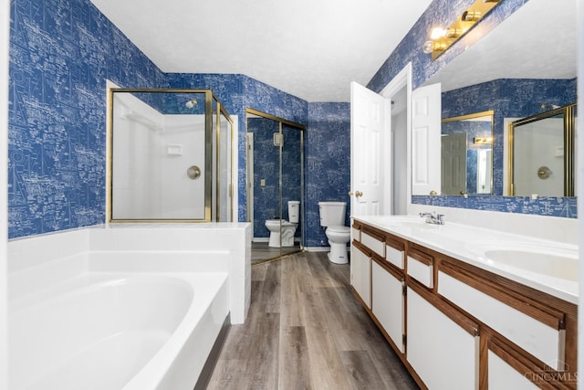 2869 Phaeton Ln, Deerfield Twp, OH 45039 - full bath featuring wallpapered walls, toilet, a stall shower, a bath, and wood finished floors