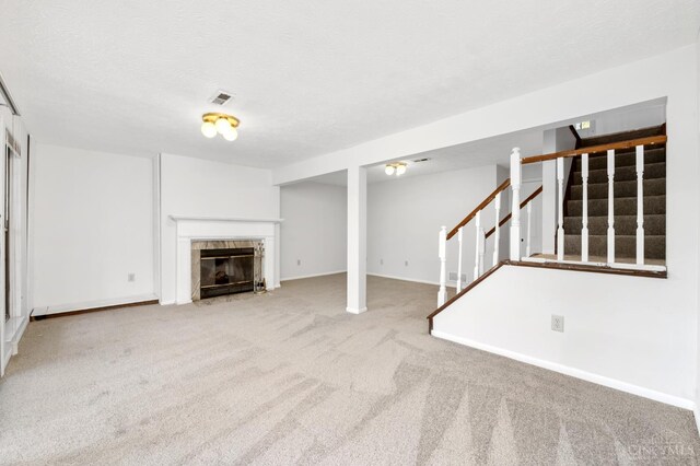 2869 Phaeton Ln, Deerfield Twp, OH 45039 - unfurnished living room with carpet flooring, stairway, a fireplace, and baseboards