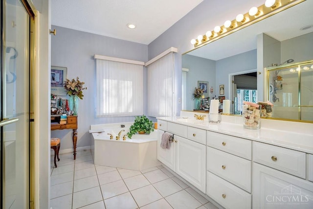 1668 Nichole Ct, Hamilton, OH 45013 - full bath featuring plenty of natural light, a stall shower, a garden tub, and tile patterned flooring
