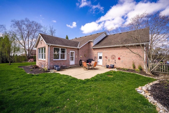 1668 Nichole Ct, Hamilton, OH 45013 - rear view of property featuring brick siding, a patio area, and roof with shingles