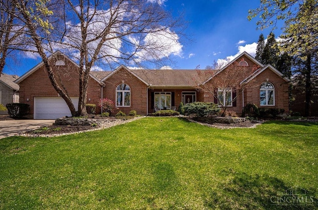 1668 Nichole Ct, Hamilton, OH 45013 - ranch-style home with brick siding, a front yard, and an attached garage