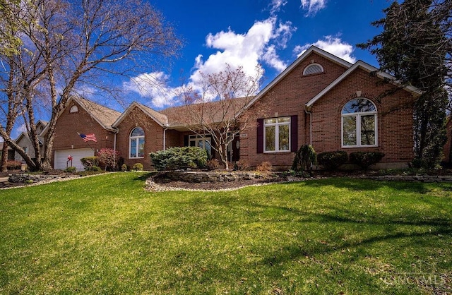 1668 Nichole Ct, Hamilton, OH 45013 - view of front of house featuring brick siding, a front lawn, and an attached garage