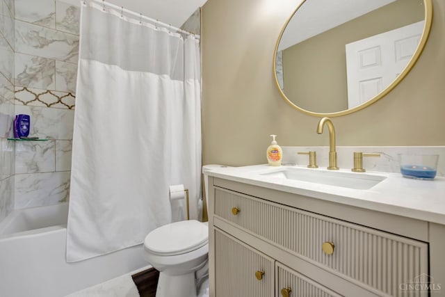 bathroom featuring toilet, vanity, and shower / bath combo