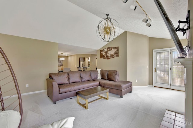 living room featuring light carpet, baseboards, and lofted ceiling