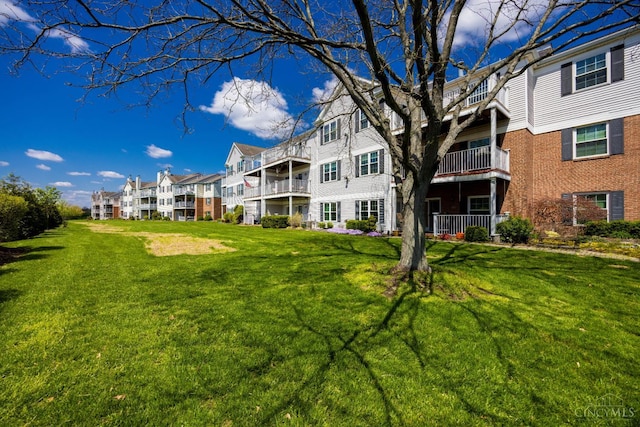 view of home's community with a lawn