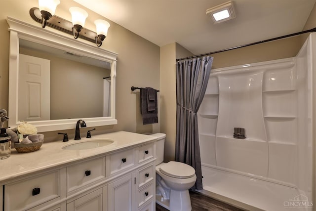 640 Frye Rd, Clay Twp, OH 45171 - full bathroom with a shower with curtain, vanity, toilet, and wood finished floors