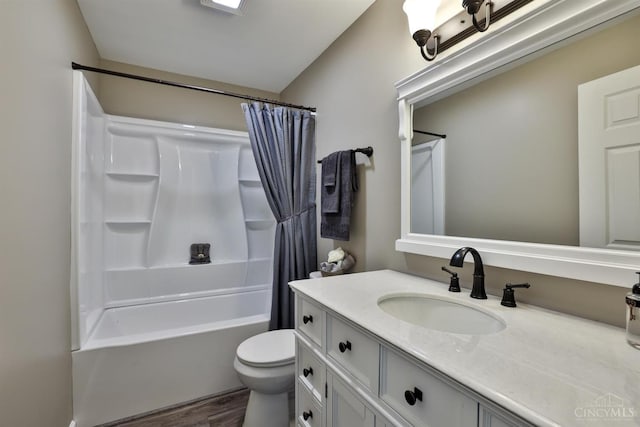 640 Frye Rd, Clay Twp, OH 45171 - full bath featuring wood finished floors, toilet, vanity, and shower / bath combination with curtain