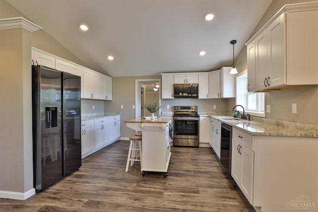 640 Frye Rd, Clay Twp, OH 45171 - kitchen featuring stainless steel appliances, a sink, dark wood-style floors, vaulted ceiling, and a kitchen island