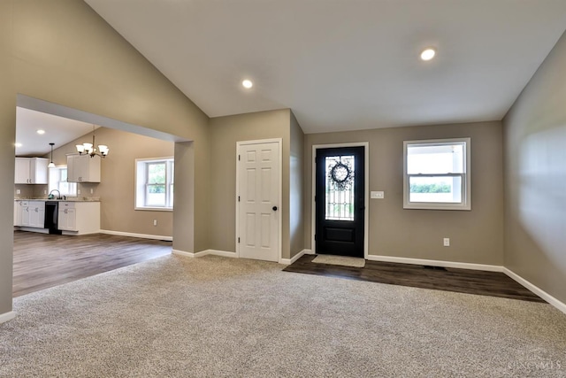 640 Frye Rd, Clay Twp, OH 45171 - entryway featuring dark colored carpet, a chandelier, baseboards, lofted ceiling, and dark wood finished floors