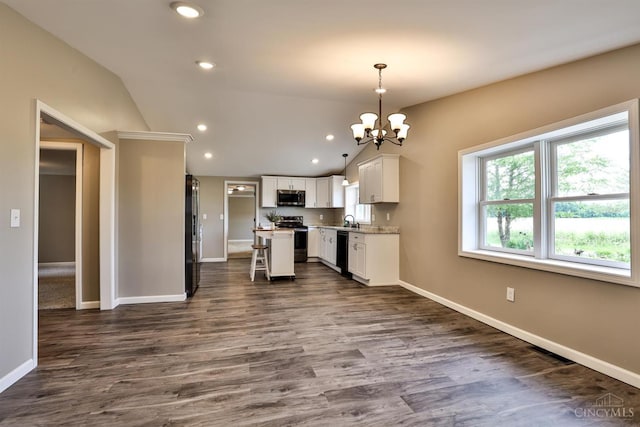 640 Frye Rd, Clay Twp, OH 45171 - kitchen with stainless steel appliances, vaulted ceiling, a chandelier, baseboards, and white cabinets