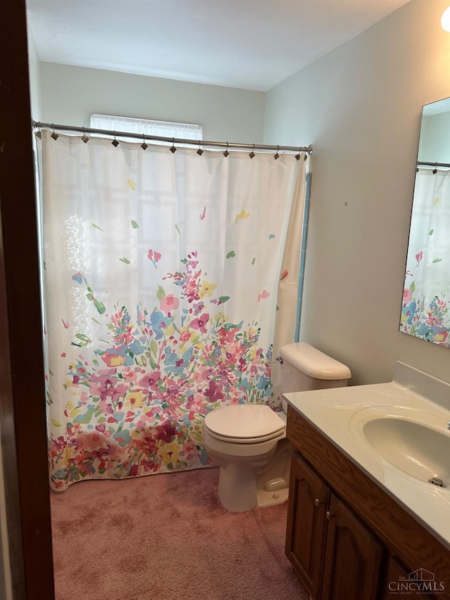 full bathroom with vanity and toilet