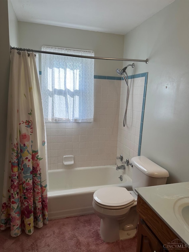 full bathroom featuring shower / tub combo, toilet, and vanity