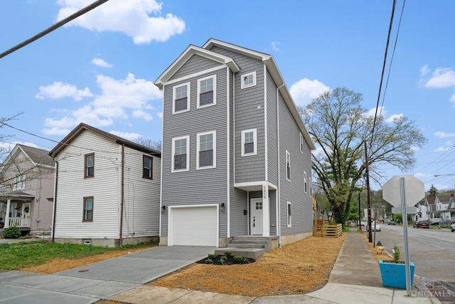 townhome / multi-family property featuring an attached garage and concrete driveway
